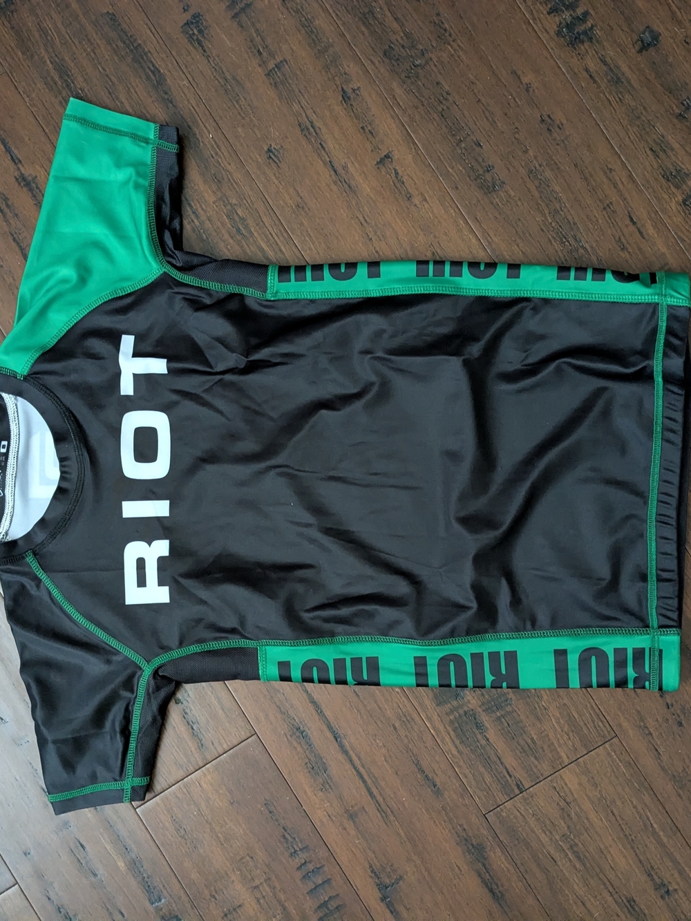 RIOT Black and Green Athletic Rash Guard